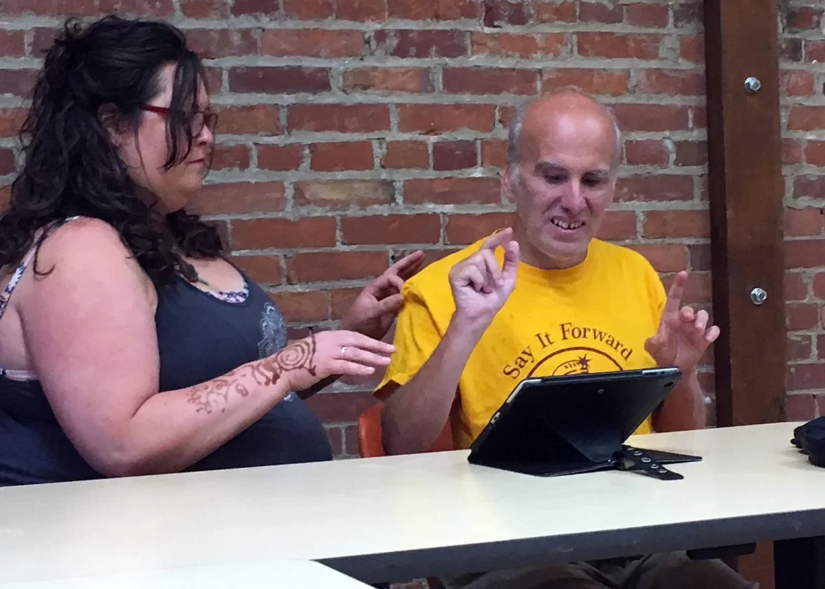 Angie and Mark Utter work together on a presentation for Advocacy Group Champlain Voices, in Colechester, VT.